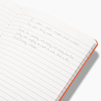 Inside of the Everyday Notebook in Lined with writing on it on a white background. 